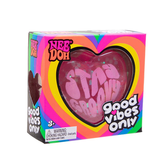 Heart-shaped toy with 'Good Vibes Only' text in a colorful box on a white background