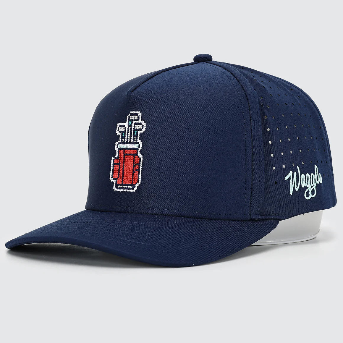 Navy blue cap with red and white logo on a light gray background, waggle brand
