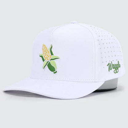 White cap with corn design and 'Waggle' branding on a light gray background