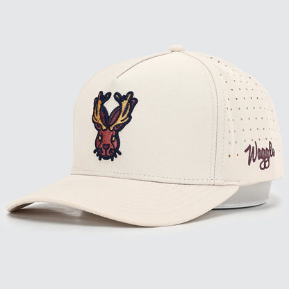 Beige cap with embroidered design and 'Waggle' branding on a light gray background