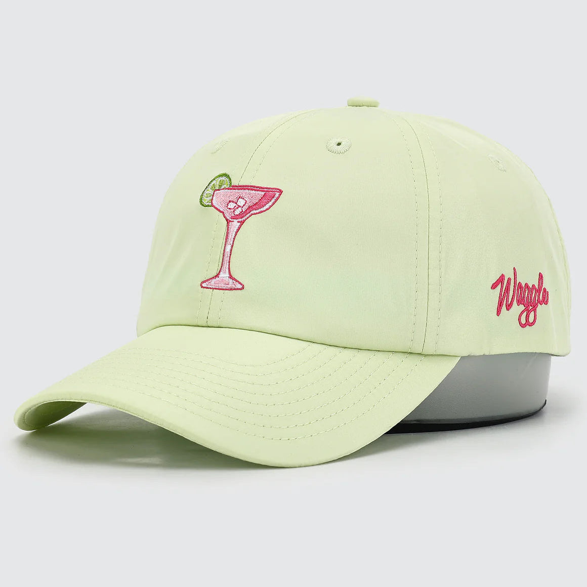 Light green cap with pink martini glass and 'Waggle' logo on a light gray background